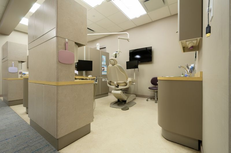 man smiling in dentists chair